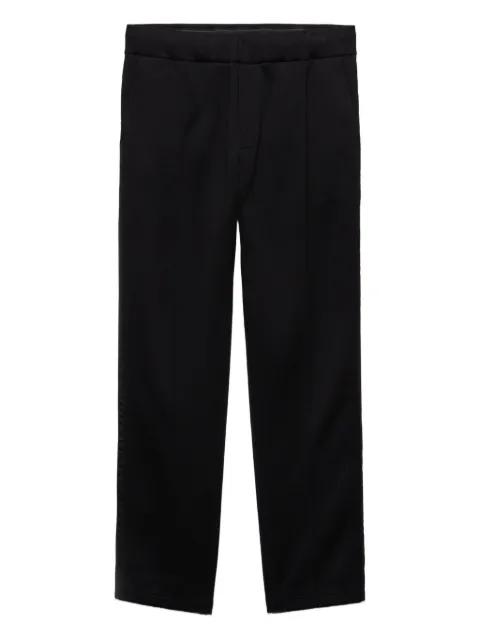 logo-plaque trousers by PRADA