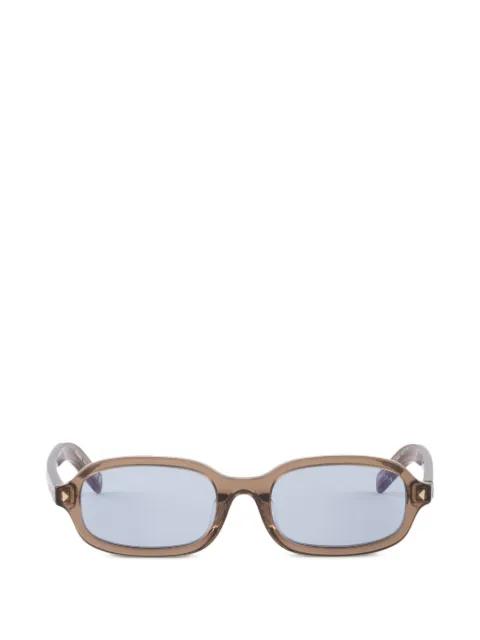 sunglasses with the iconic metal plaque by PRADA