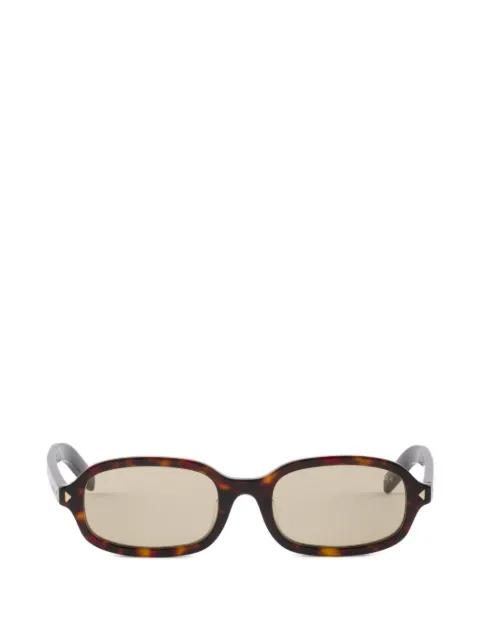 sunglasses with the iconic metal plaque by PRADA