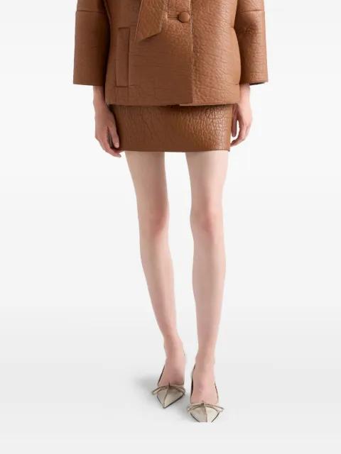 textured leather mini skirt by PRADA