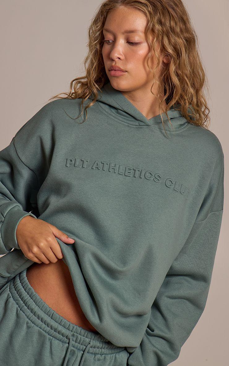 PRETTYLITTLETHING  Athletics Club Embossed Graphic Oversized Hoodie by PRETTYLITTLETHING