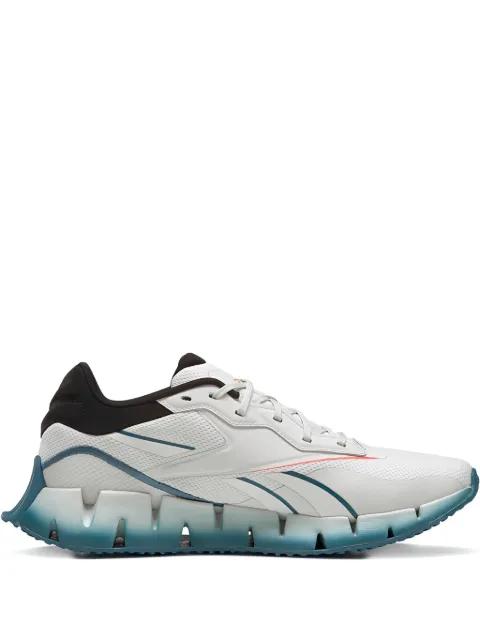 Zig Dynamica 4 "Pure Grey Orange Flared" trainers by REEBOK
