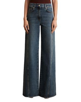 Petite Fern Twist Seam High Rise Wide Leg Jeans in Mid Blue by REISS