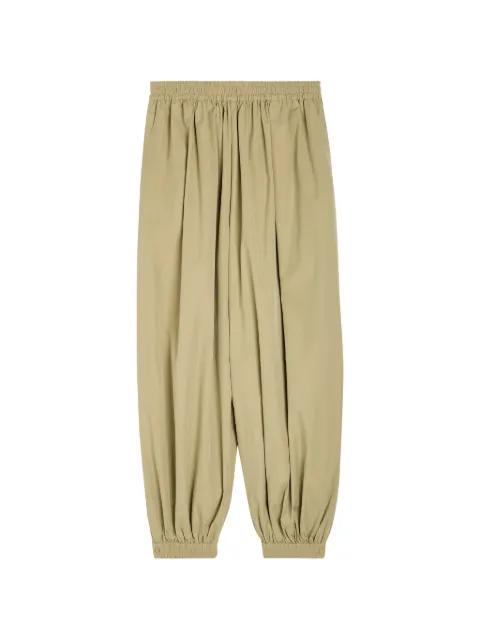 Kalani pleated elasticated-cuff trousers by RONNY KOBO