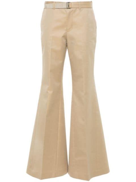 flared belted trousers by SACAI
