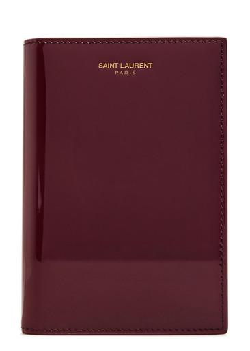 Logo-stamped patent leather passport holder by SAINT LAURENT