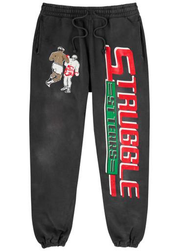 Denim Tears Struggle printed cotton sweatpants by SAINT MXXXXXX