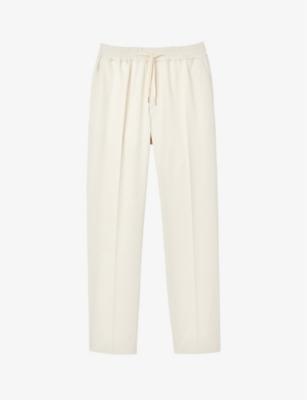 Tapered drawstring-waist stretch-cotton blend trousers by SANDRO PARIS