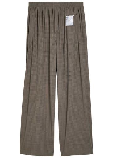 Space-O perforated stretch-nylon trousers by SATISFY