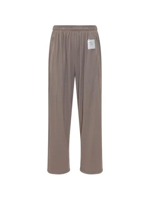 Space-O perforated track pants by SATISFY