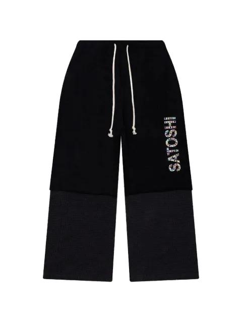 double-layer studded track pants by SATOSHI NAKAMOTO