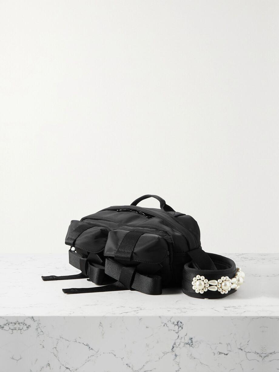 Bow and pearl-like embellished shell belt bag by SIMONE ROCHA