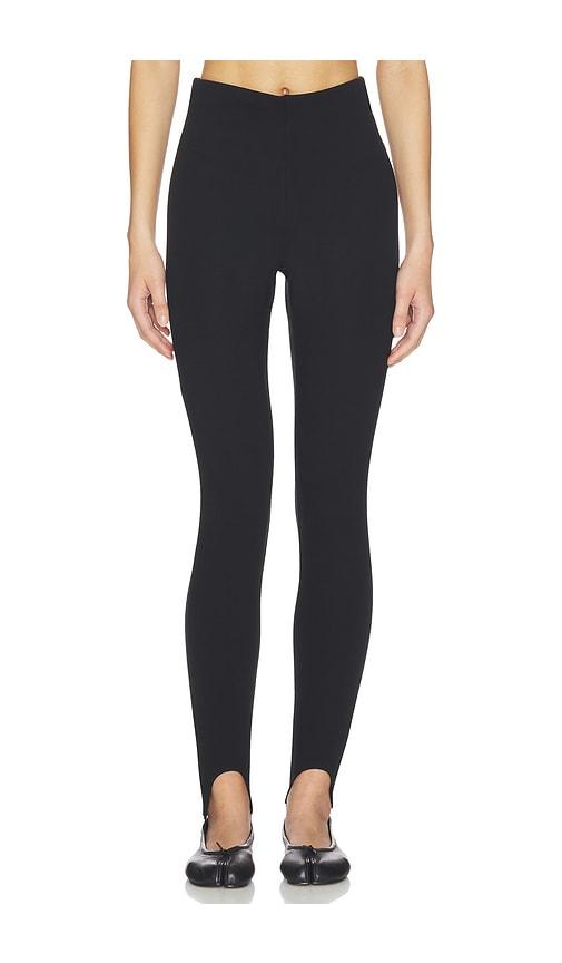 SKIMS Essential High Waist Stirrup Legging in Black by SKIMS