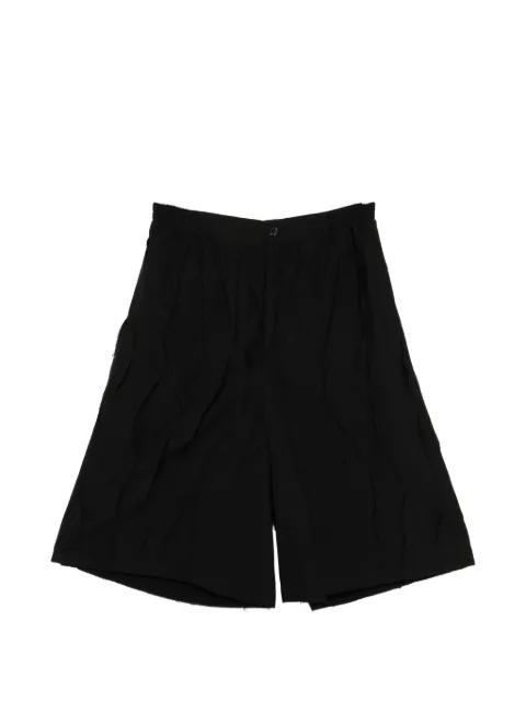 button pleated shorts by SONGZIO
