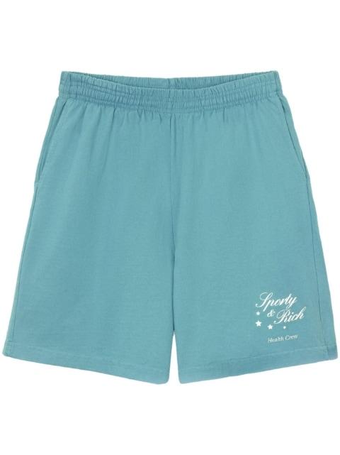 Stars Health logo-print shorts by SPORTY&RICH