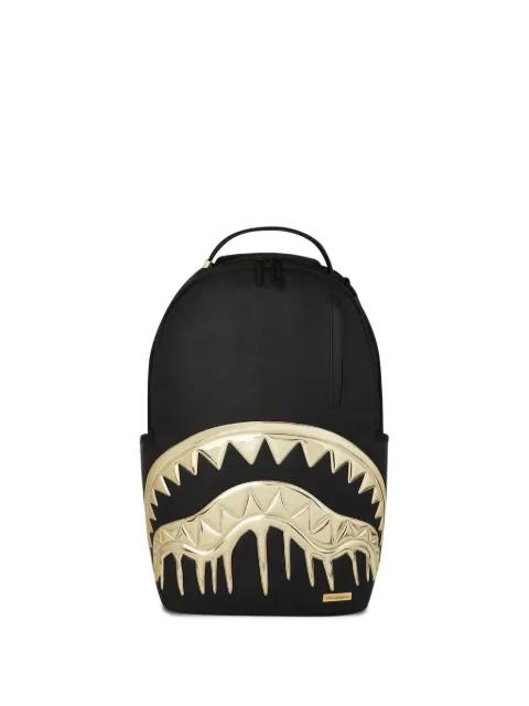 Gold and Dangerous metallic-teeth backpack by SPRAYGROUND