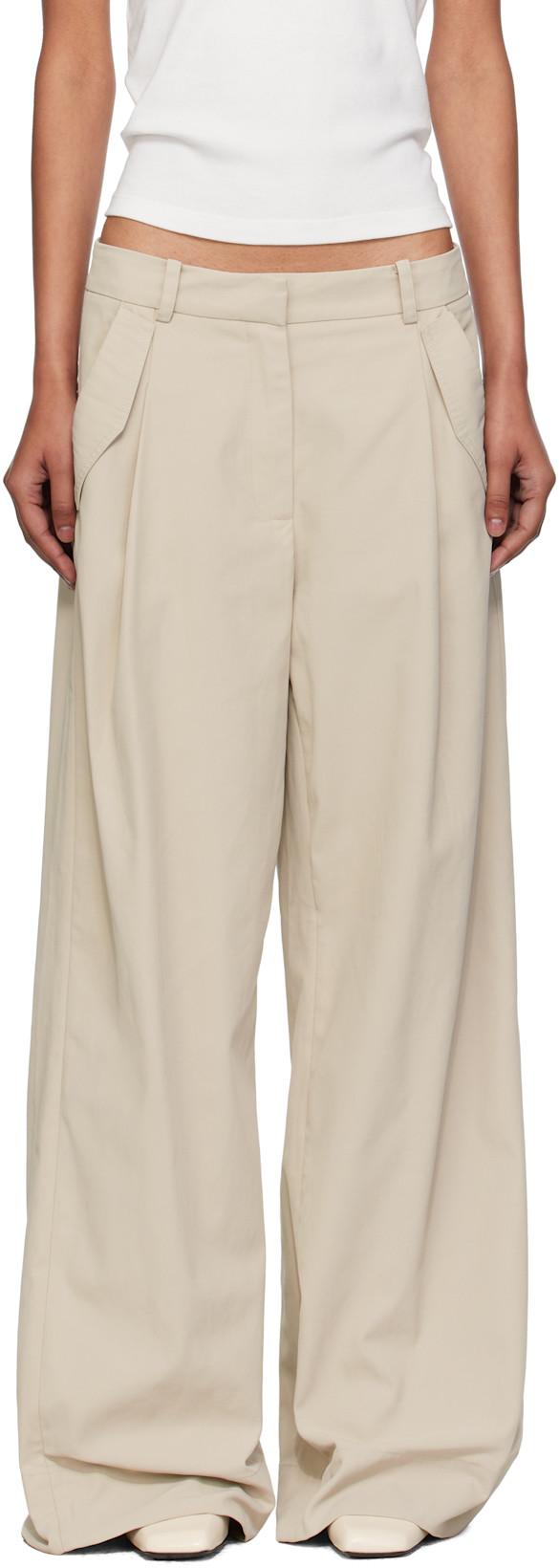 Beige Utility Pleat Trousers by ST. AGNI