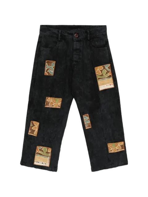 patchwork acid-wash jeans by STAIN SHADE