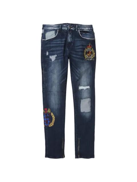 distressed crest-embroidered jeans by STAPLE