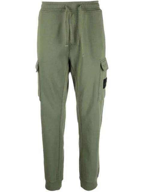 Compass badge track pants by STONE ISLAND