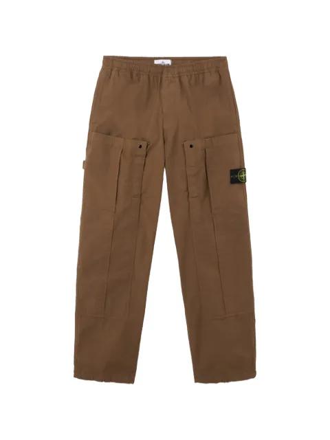 Compass-badge trousers by STONE ISLAND
