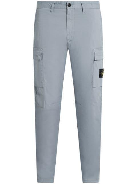 Compass-badge trousers by STONE ISLAND