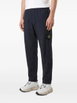 Compass-motif track pants by STONE ISLAND