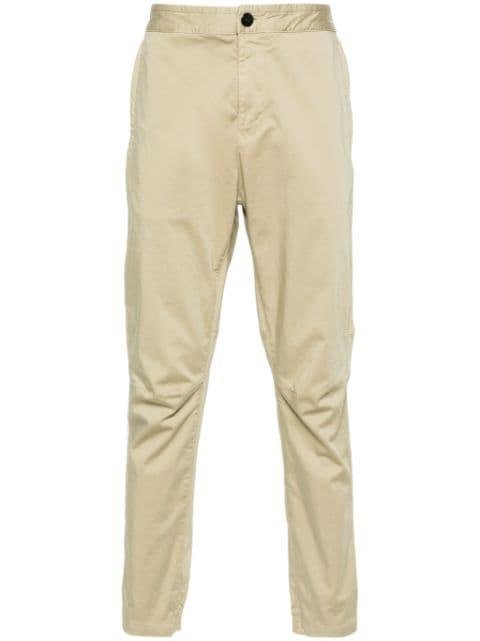 Compass-patch tapered trousers by STONE ISLAND