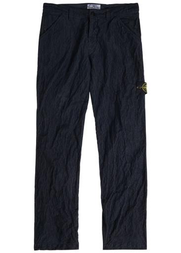 Logo crinkled tapered-leg corduroy trousers by STONE ISLAND