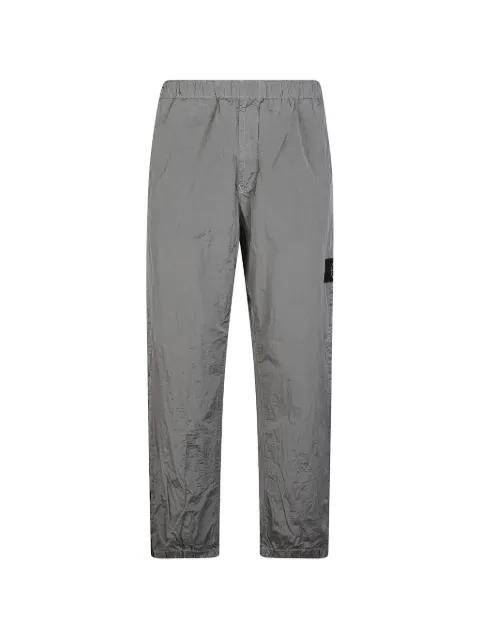 logo-patch crinkled trousers by STONE ISLAND