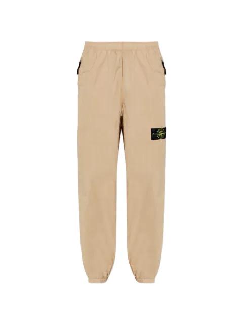 logo-patch trousers by STONE ISLAND