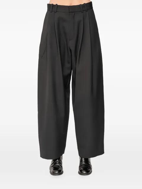 Line pleat-detail trousers by STUDIO NICHOLSON