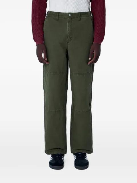 logo-detail trousers by STUSSY
