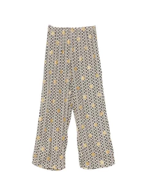 Symi geometric-pattern trousers by SUNDRESS