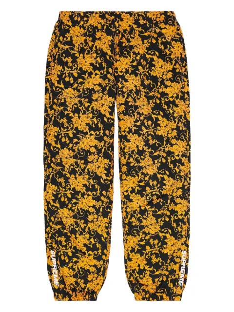 floral-pattern track pants by SUPREME