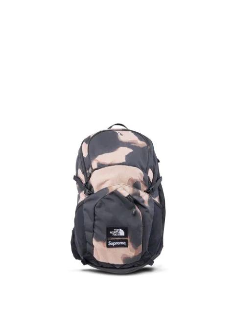 x The North Face Pocon bleached denim-print backpack by SUPREME