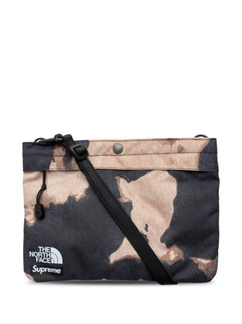 x The North Face bleached denim print shoulder bag by SUPREME