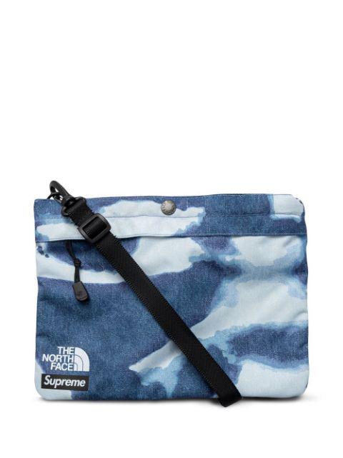 x The North Face bleached denim-print shoulder bag by SUPREME