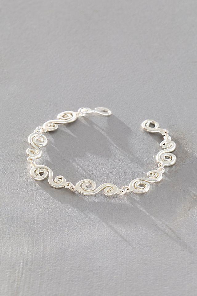 Takara Spiral Bracelet by TAKARA | FREE PEOPLE