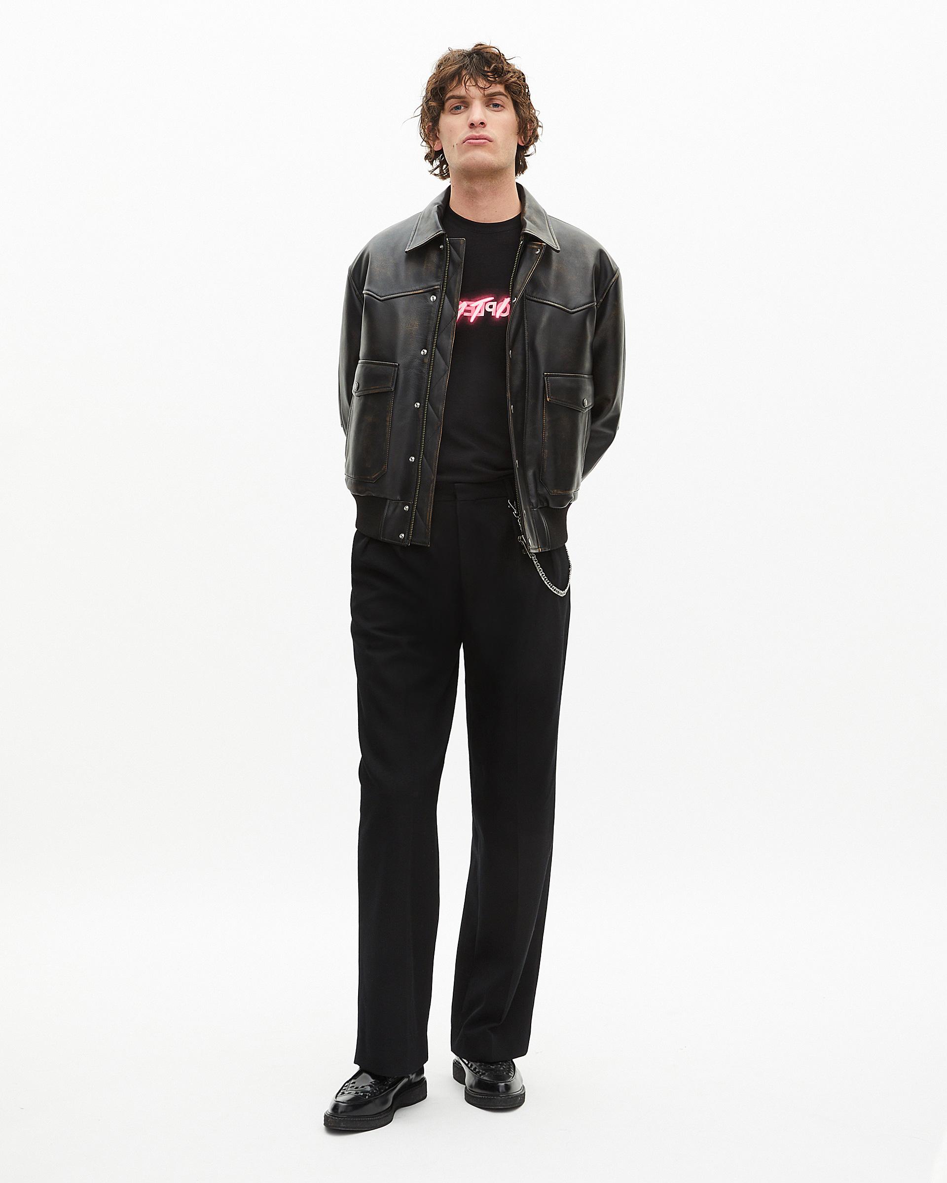 Black wide-leg wool pants by THE KOOPLES