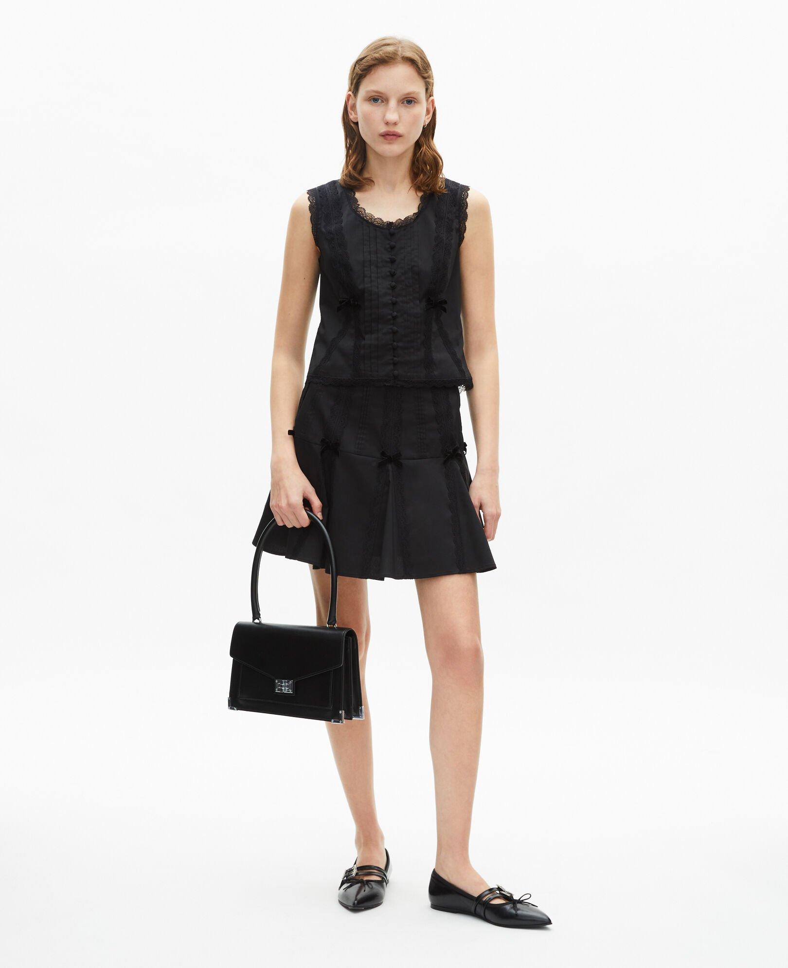 Short skirt with black bow detail by THE KOOPLES