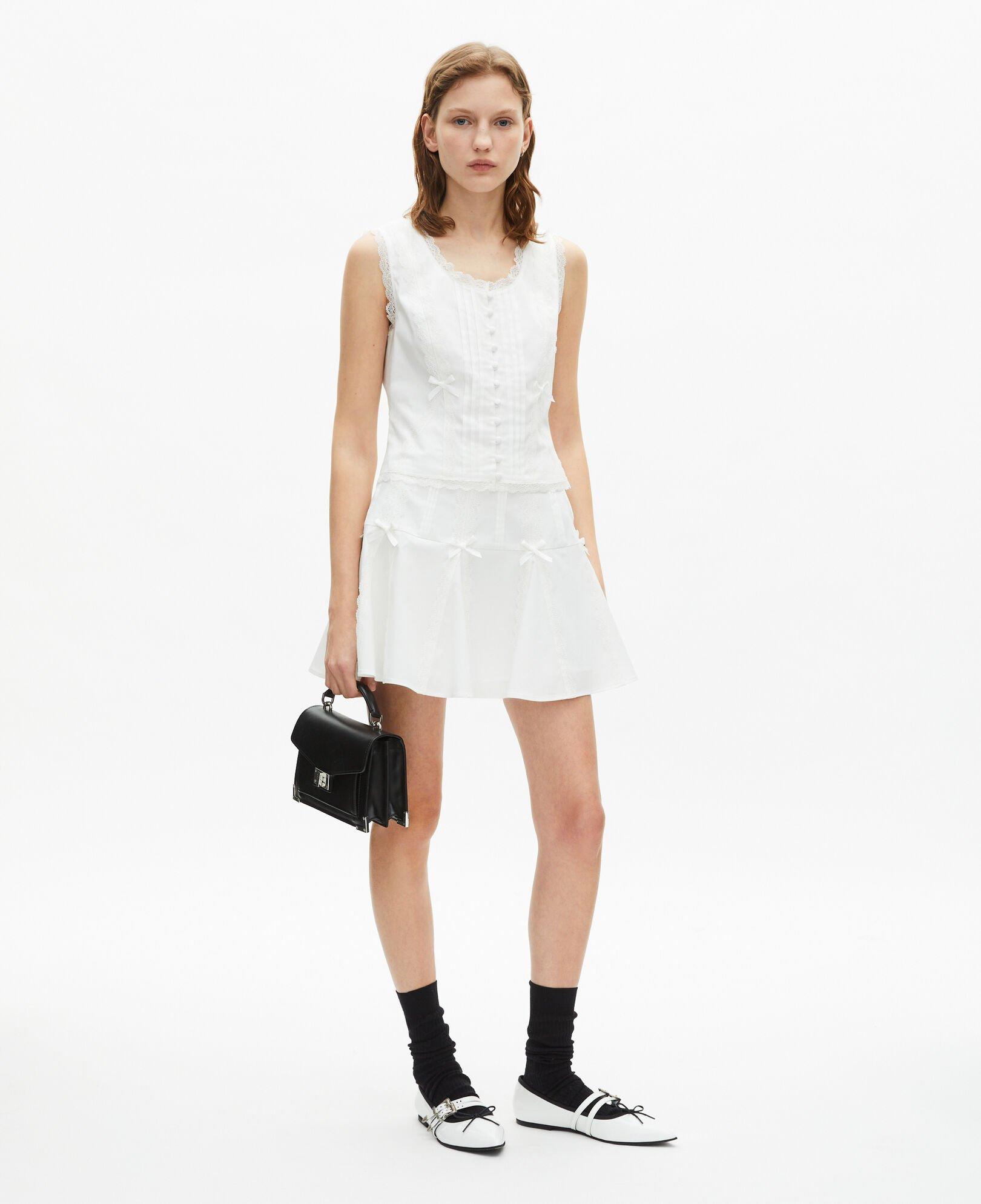 Short skirt with bow detail in ecru by THE KOOPLES