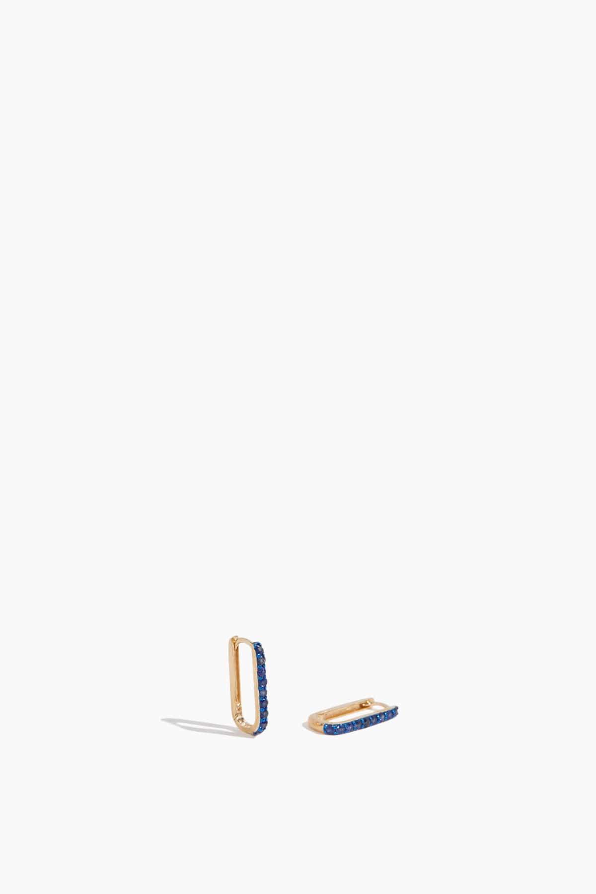 Blue Sapphire Elongated Huggies in 14k Yellow Gold by THEODOSIA