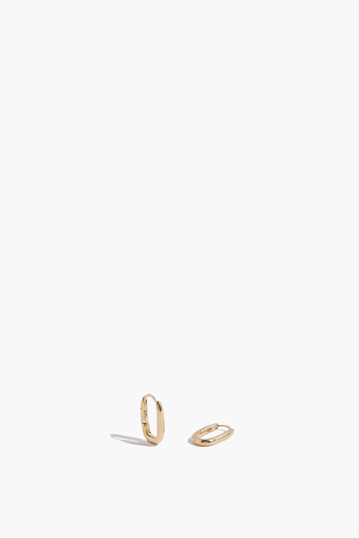 Elongated Oval Huggies in 14k Yellow Gold by THEODOSIA