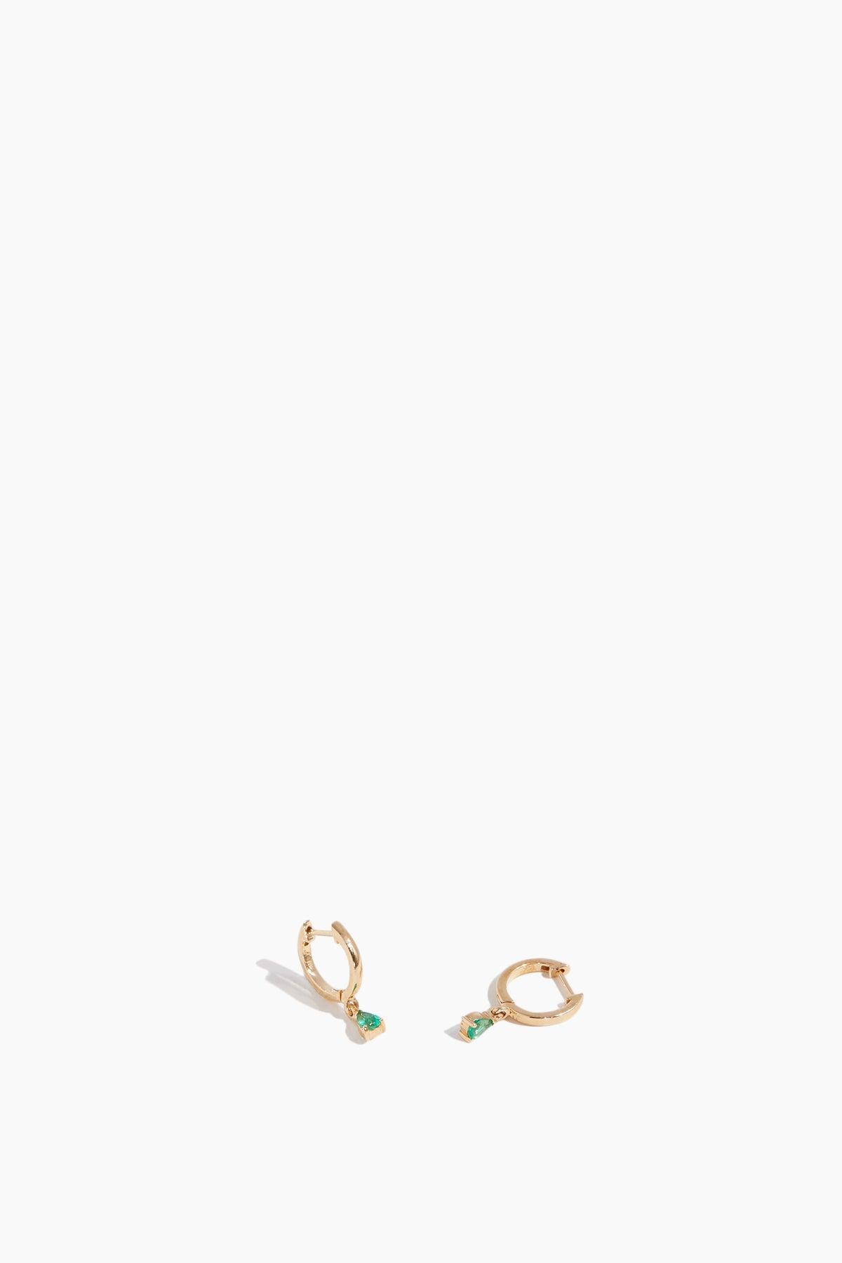 Emerald Drop Huggies in 14k Yellow Gold by THEODOSIA