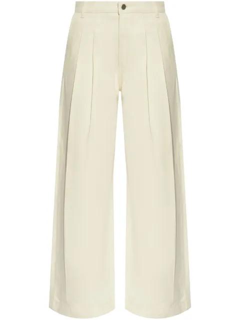 pleat-detailing trousers by THEORY