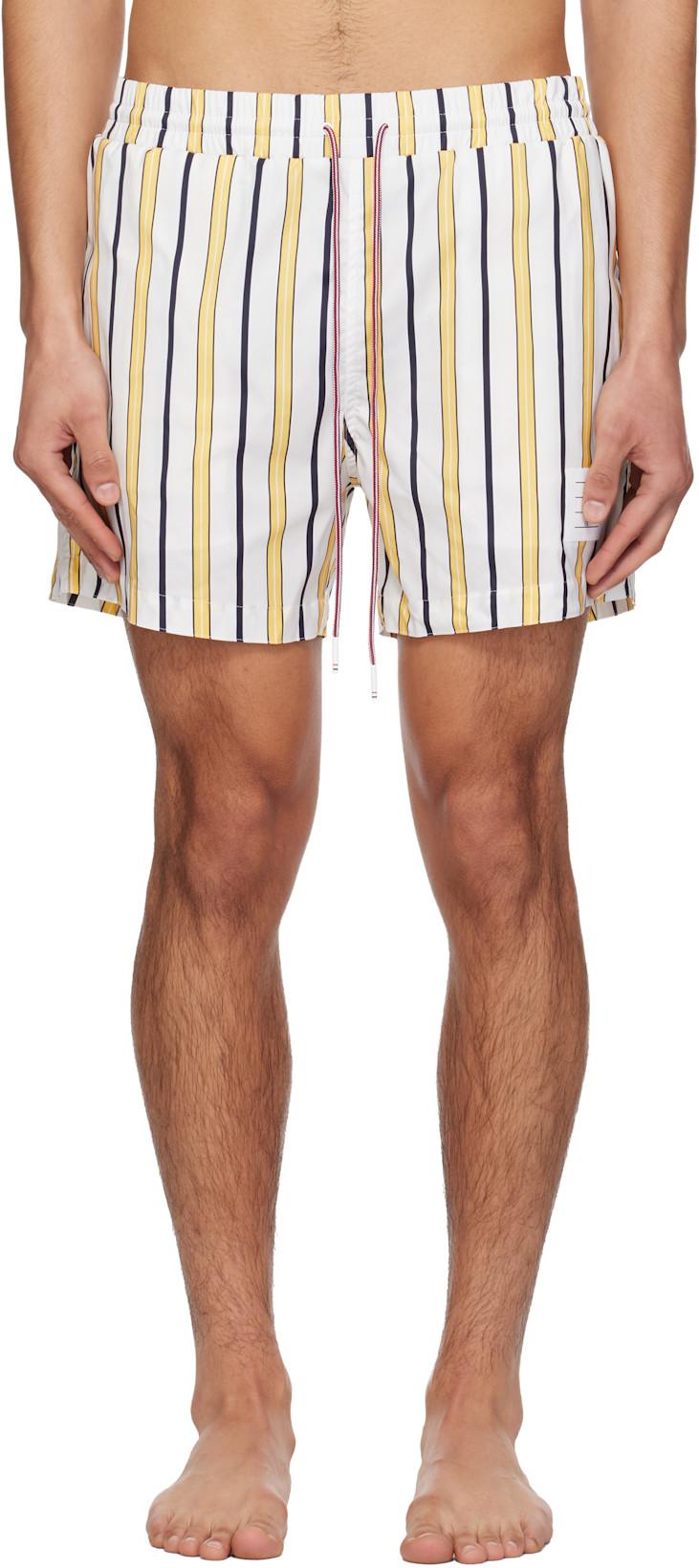 White & Yellow Repp Stripe Swim Shorts by THOM BROWNE