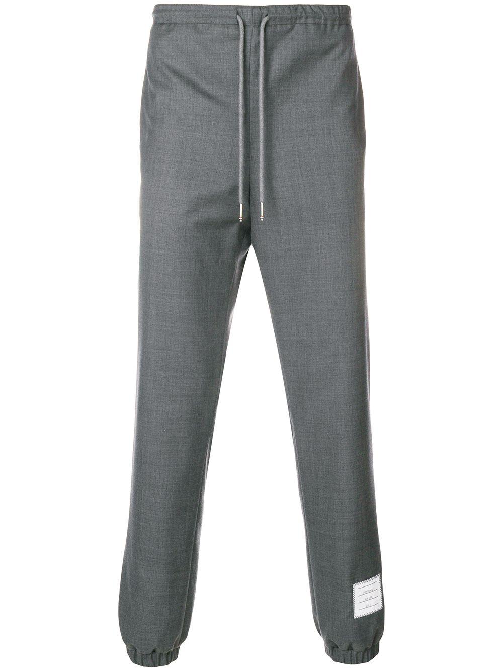 drawstring-waist wool track pants by THOM BROWNE