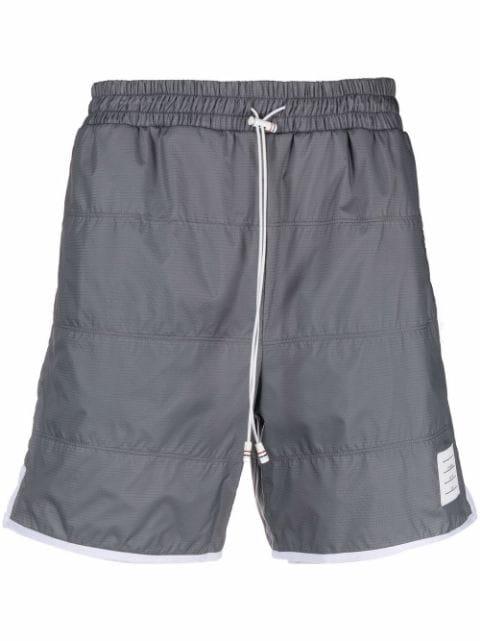 ripstop track shorts by THOM BROWNE