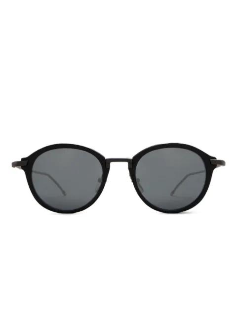 round-frame glasses by THOM BROWNE